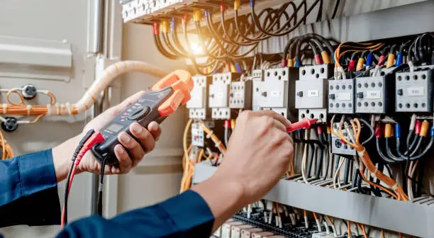 <img src="electrician.webp" alt="electrician working on sqare d electrical panel" /> 
